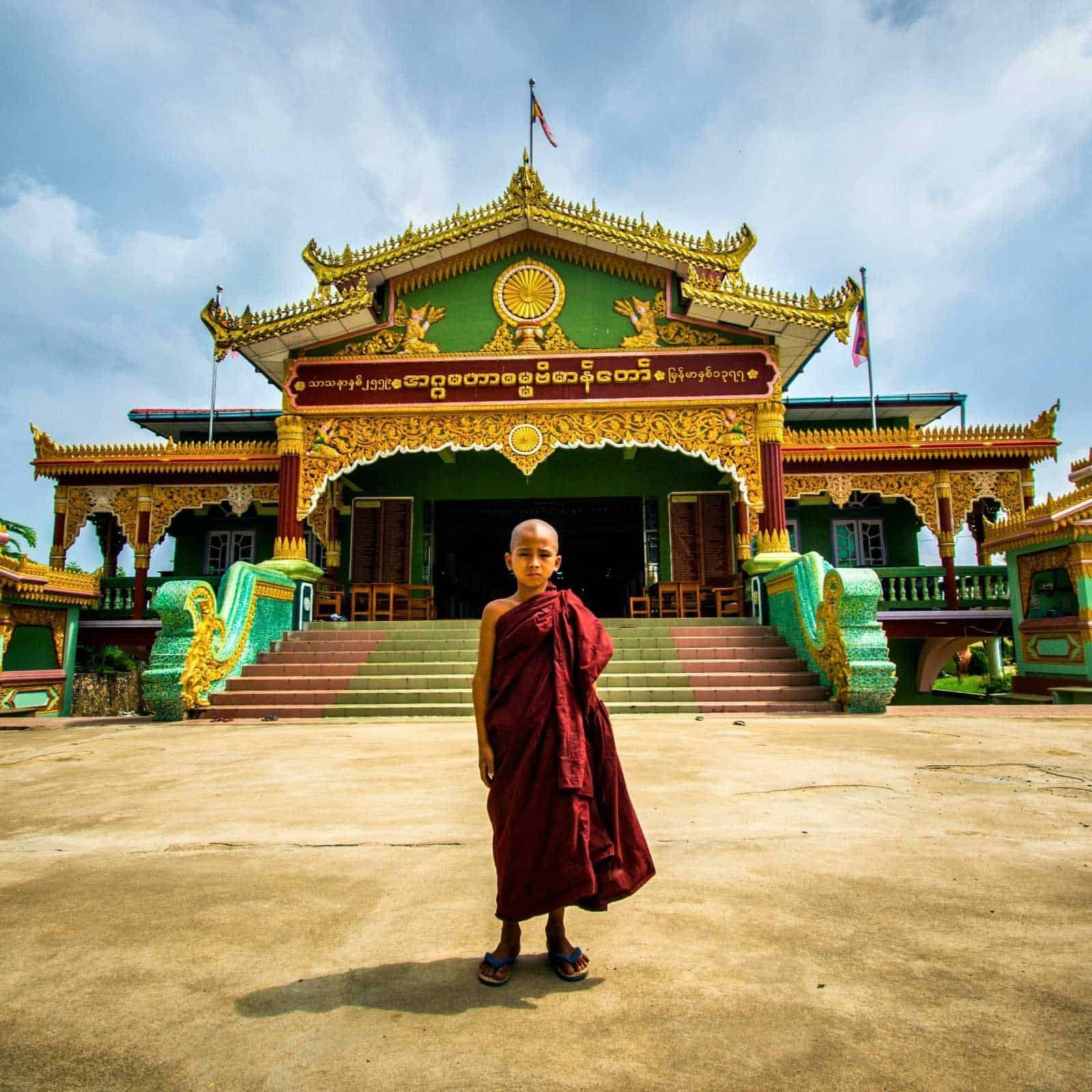 Boy Standing in Front of Temple, Mandalay