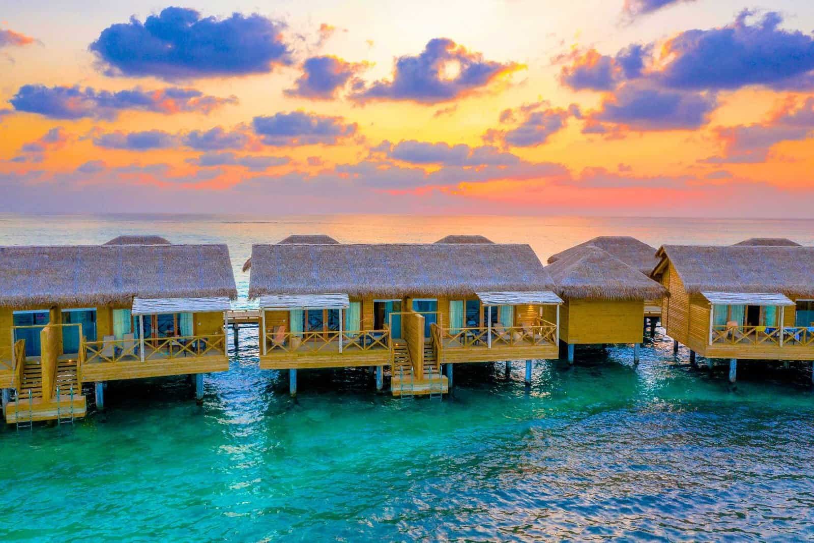 Overwater Bungalows at Sunrise in Maldives